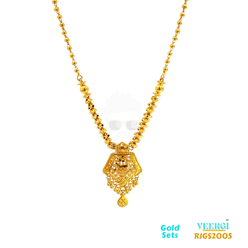 The 22kt gold chain set features a top half chain that consists of gold balls and a bottom half chain that is attached to a pendant. The bottom half chain goes through a gold ring, which adds an interesting design element to the piece. Weight: 24.10gm Length of Necklace and Earring 21.50/3.50cm